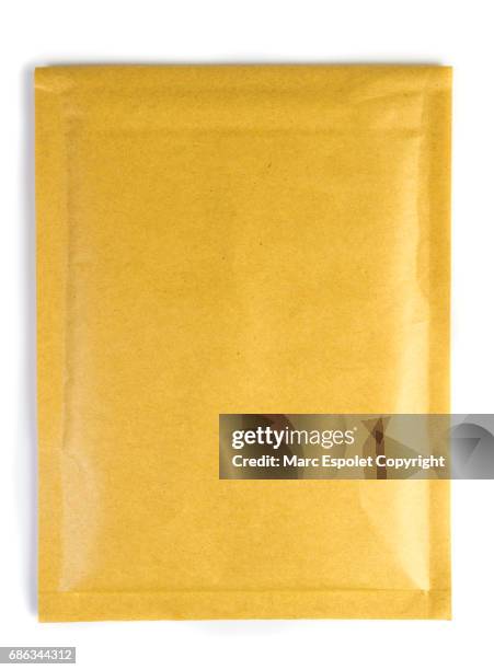 padded envelope - yellow envelope stock pictures, royalty-free photos & images