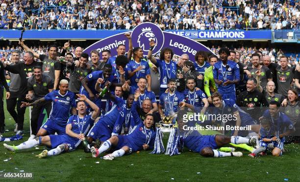 The Chelsea team celebrate with the Premier League Trophy after the Premier League match between Chelsea and Sunderland at Stamford Bridge on May 21,...