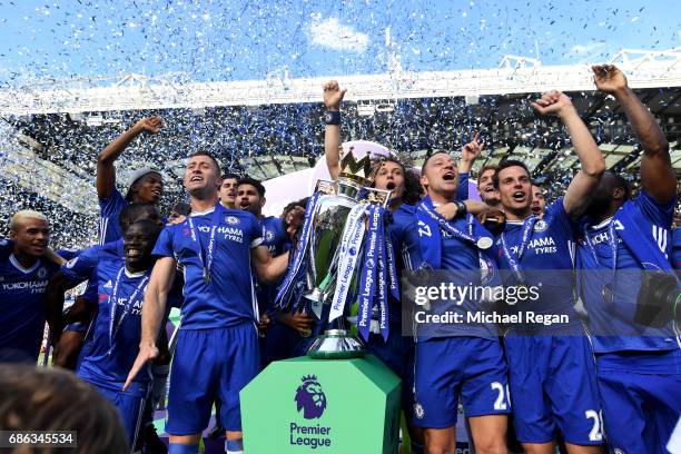 John Terry of Chelsea celebrates with the Premier League Trophy and his Chelsea team mates after the Premier League match between Chelsea and...