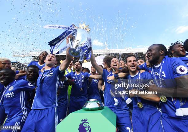John Terry of Chelsea celebrates with the Premier League Trophy with his Chelsea team mates after the Premier League match between Chelsea and...