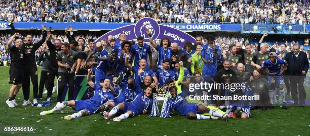 The Chelsea team celebrate with the Premier League Trophy after the Premier League match between Chelsea and Sunderland at Stamford Bridge on May 21,...