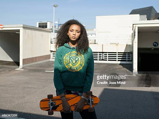 teenage girl with skateboard - bald girl stock-fotos und bilder