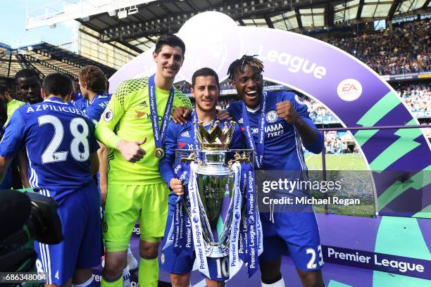 Thibaut Courtois of Chelsea, Eden Hazard of Chelsea and Michy Batshuayi of Chelse pose with the Premier League Trophy after the Premier League match...