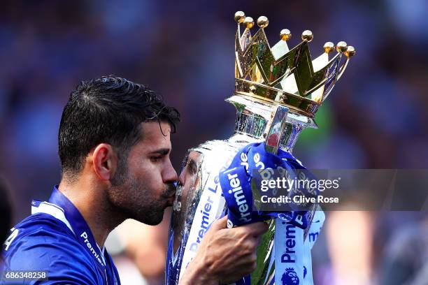 Diego Costa of Chelsea kisses the Premier League Trophy after the Premier League match between Chelsea and Sunderland at Stamford Bridge on May 21,...