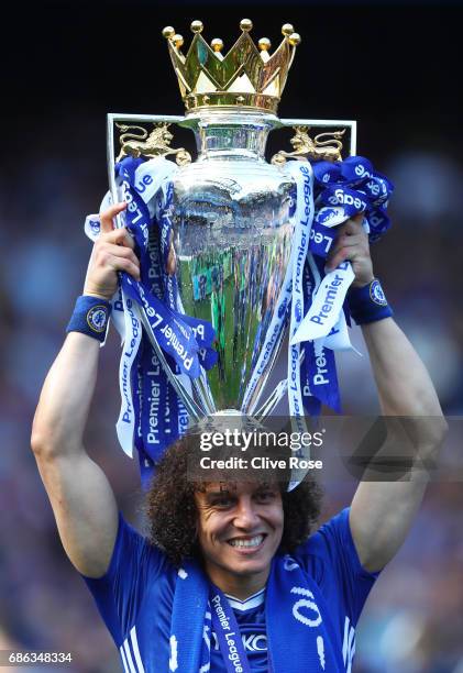 David Luiz of Chelsea celebrates with the Premier League Trophy after the Premier League match between Chelsea and Sunderland at Stamford Bridge on...