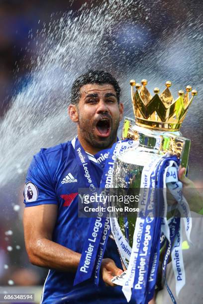 Diego Costa of Chelsea celebrates with the Premier League Trophy after the Premier League match between Chelsea and Sunderland at Stamford Bridge on...