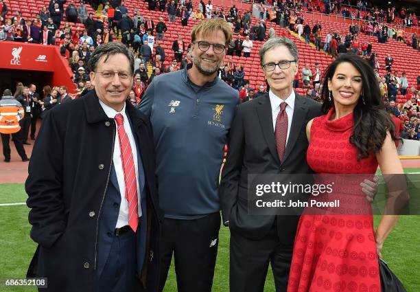 Tom Werner Chairman of Liverpool poses with Jurgen Klopp manager of Liverpool and John W Henry Principal owner with wife Linda Pizzuti at the end of...