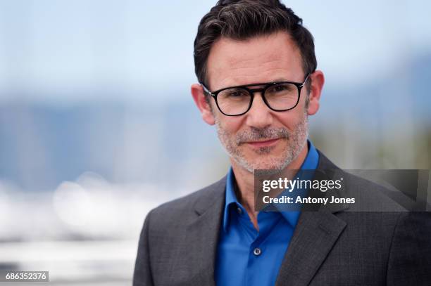 Director Michel Hazanavicius attends the "Redoubtable " photocall during the 70th annual Cannes Film Festival at Palais des Festivals on May 21, 2017...