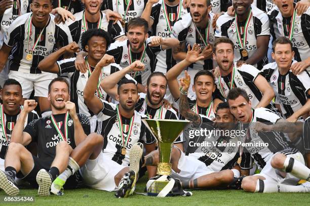 Juventus FC players celebrate with the trophy after the beating FC Crotone 3-0 to win the Serie A Championships at the end of the Serie A match...