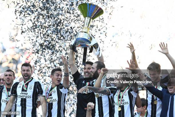 Gianluigi Buffon of Juventus FC celebrates with the trophy after the beating FC Crotone 3-0 to win the Serie A Championships at the end of the Serie...