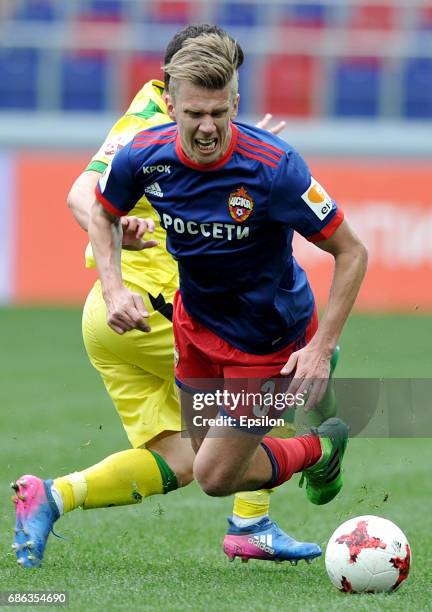 Pontus Wernbloom of PFC CSKA Moscow is challenged by Pavel Dolgov of FC Anji Makhachkala during the Russian Premier League match between PFC CSKA...