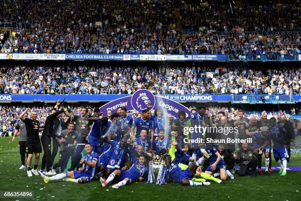 The Chelsea team celebrate with the Premier League Trophy after the Premier League match between Chelsea and Sunderland at Stamford Bridge on May 21,...