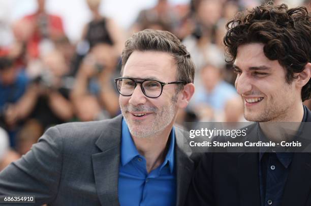 Actor Louis Garrel and Director Michel Hazanavicius attend the "Redoubtable " photocall during the 70th annual Cannes Film Festival at Palais des...