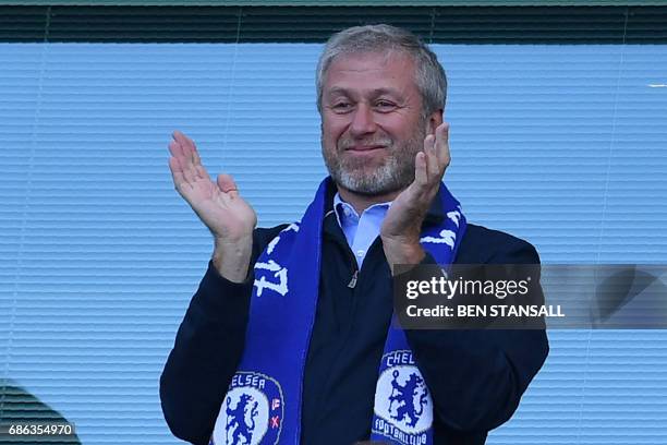 Chelsea's Russian owner Roman Abramovich applauds, as players celebrate their league title win at the end of the Premier League football match...