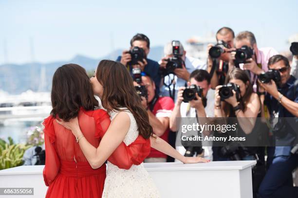 Actresses Stacy Martin and Berenice Bejo attend the "Redoubtable " photocall during the 70th annual Cannes Film Festival at Palais des Festivals on...