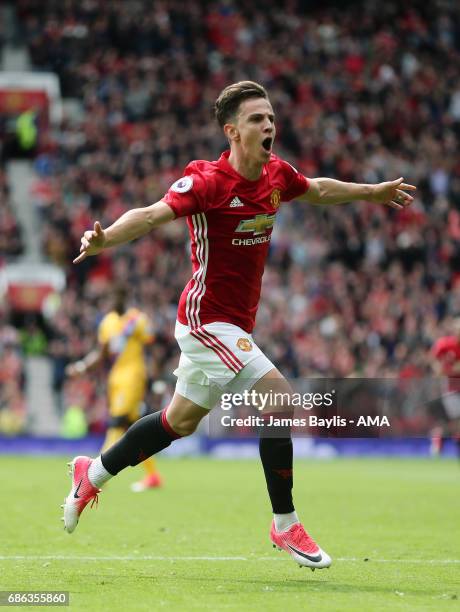Josh Harrop of Manchester United celebrates after scoring a goal to make it 1-0 during the Premier League match between Manchester United and Crystal...