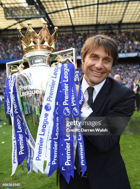 Antonio Conte, Manager of Chelsea poses with the Premier League Trophy after the Premier League match between Chelsea and Sunderland at Stamford...