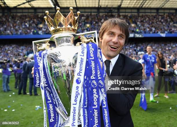 Antonio Conte, Manager of Chelsea poses with the Premier League Trophy after the Premier League match between Chelsea and Sunderland at Stamford...