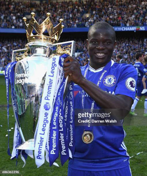Golo Kante of Chelsea poses with the Premier League Trophy after the Premier League match between Chelsea and Sunderland at Stamford Bridge on May...