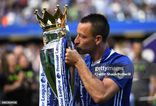 John Terry of Chelsea kisses the Premier League Trophy after the Premier League match between Chelsea and Sunderland at Stamford Bridge on May 21,...