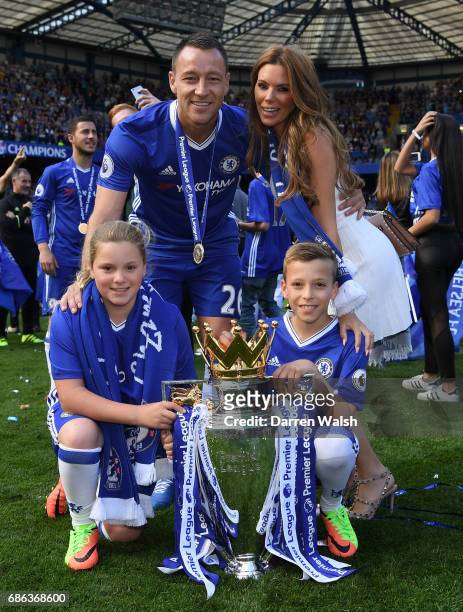 John Terry of Chelsea poses with Premier League trophy alongise Toni Terry, wife, Summer Rose Terry, daughter and Georgie John Terry, son after the...