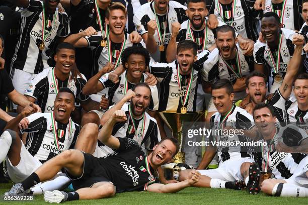 Juventus FC players celebrate with the trophy after the beating FC Crotone 3-0 to win the Serie A Championships at the end of the Serie A match...