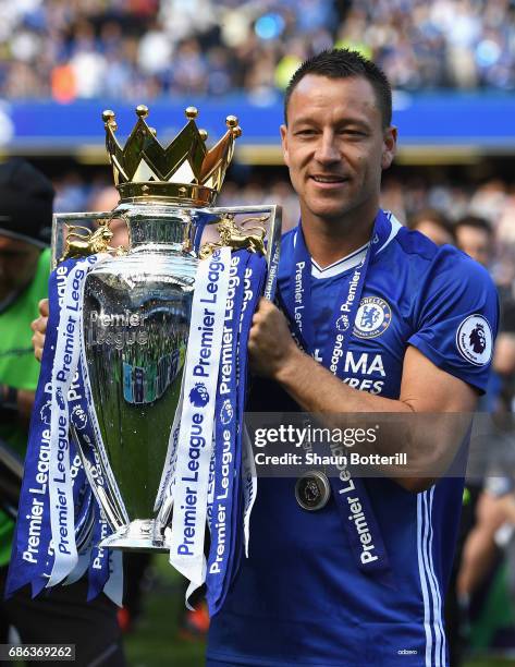 John Terry of Chelsea poses with the Premier League Trophy after the Premier League match between Chelsea and Sunderland at Stamford Bridge on May...