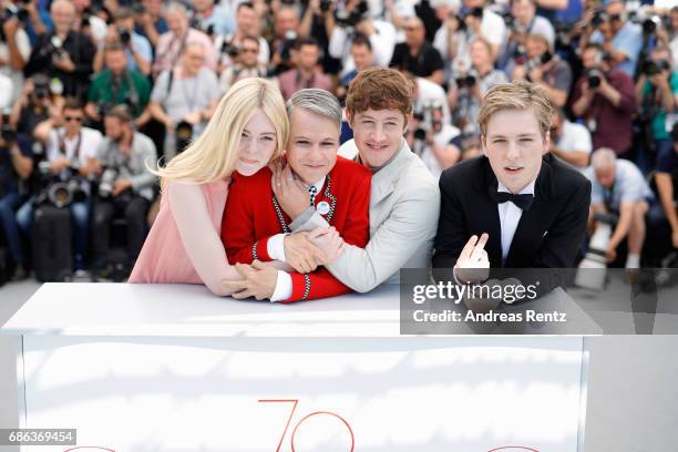 Actress Elle Fanning, director John Cameron Mitchell, Actors Alex Sharp and AJ Lewis attend the "How To Talk To Girls At Parties" photocall during...