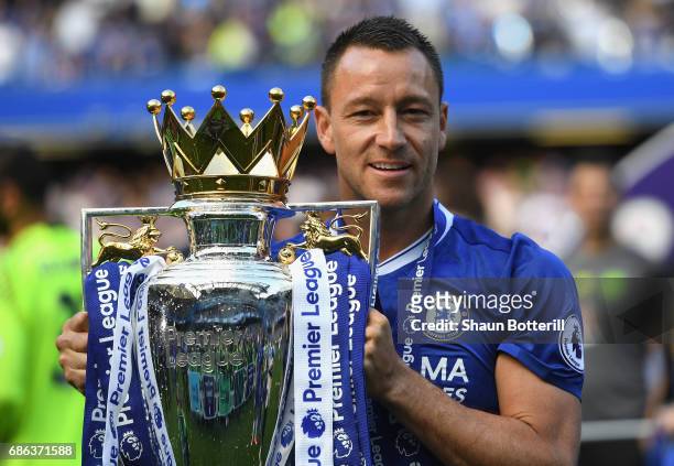 John Terry of Chelsea poses with the Premier League Trophy after the Premier League match between Chelsea and Sunderland at Stamford Bridge on May...