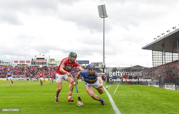 Tipperary , Ireland - 21 May 2017; John OKeeffe of Tipperary attempts to prevent a sideline ball under pressure from Alan Cadogan of Cork during the...
