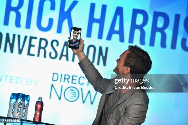 Actor Neil Patrick Harris video chats with his husband David Burtka onstage during Neil Patrick Harris: In Conversation in the AT&T Studio during the...
