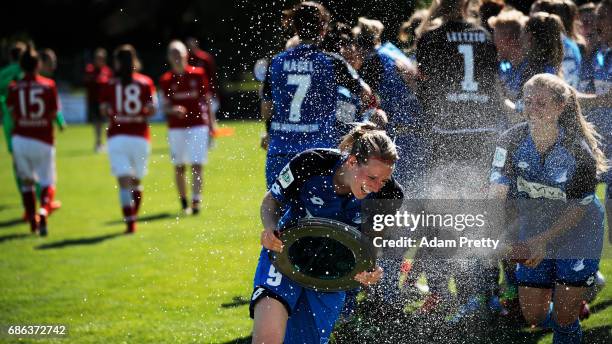 Annika Eberhardt of Hoffenheim II is sprayed with champagne while celebrating with the Bundesliga II trophy after victory in the match between 1899...