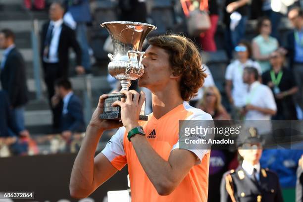 Alexander Zverev of Germany poses for a photo with his trophy after winning the Men's Single Final match against Novak Djokovic of Serbia during day...