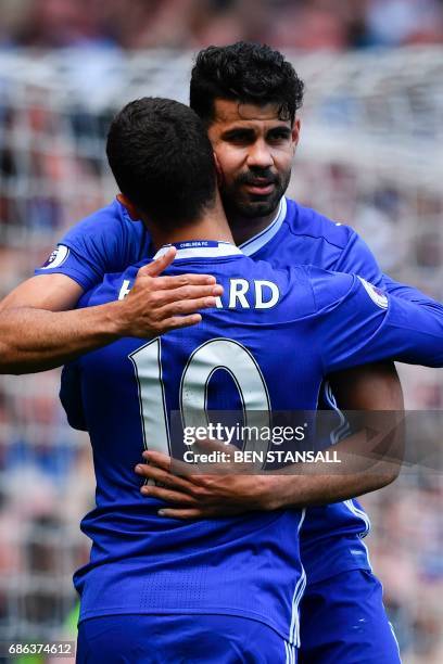 Chelsea's Belgian midfielder Eden Hazard emabraces Chelsea's Brazilian-born Spanish striker Diego Costa after scoring their second goal during the...