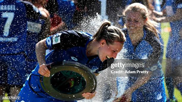 Annika Eberhardt of Hoffenheim II is sprayed with champagne while celebrating with the Bundesliga II trophy after victory in the match between 1899...