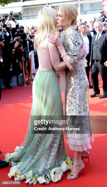 Elle Fanning and Nicole Kidman depart after the "How To Talk To Girls At Parties" screening during the 70th annual Cannes Film Festival at Palais des...