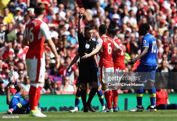 Laurent Koscielny of Arsenal is shown the red card during the Premier League match between Arsenal and Everton at Emirates Stadium on May 21, 2017 in...