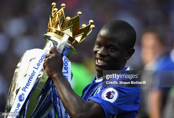 Golo Kante of Chelsea poses with the Premier League Trophy after the Premier League match between Chelsea and Sunderland at Stamford Bridge on May...