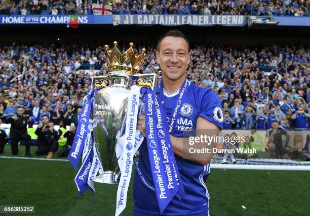 John Terry of Chelsea poses with the Premier League Trophy after the Premier League match between Chelsea and Sunderland at Stamford Bridge on May...