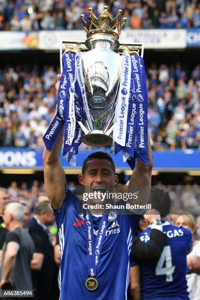 Gary Cahill of Chelsea celebrates with the Premier League Trophy after the Premier League match between Chelsea and Sunderland at Stamford Bridge on...