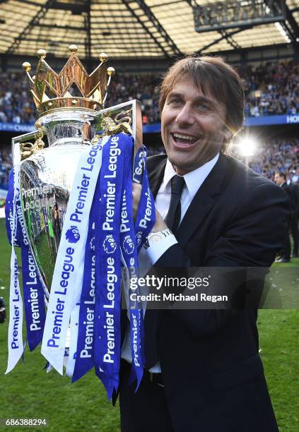 Antonio Conte, Manager of Chelsea poses with the Premier League Trophy after the Premier League match between Chelsea and Sunderland at Stamford...