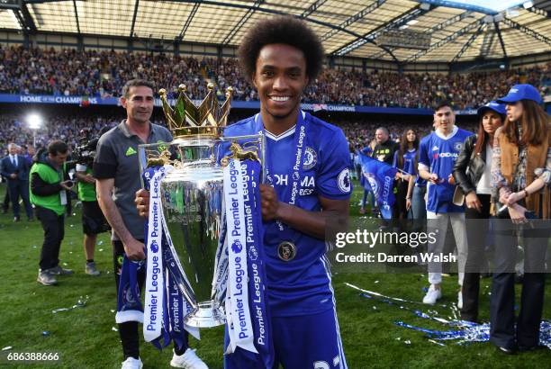 Willian of Chelsea poses with the Premier League Trophy after the Premier League match between Chelsea and Sunderland at Stamford Bridge on May 21,...