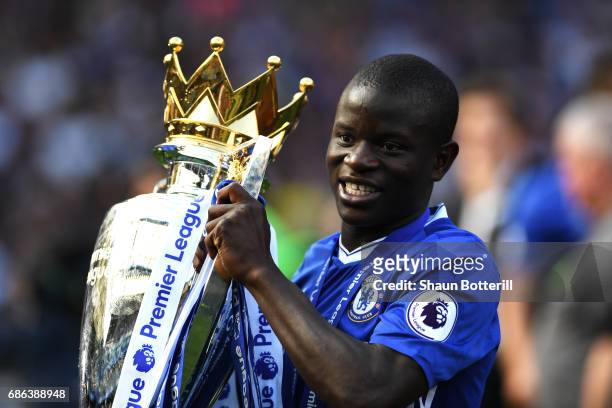 Golo Kante of Chelsea celebrates with the Premier League Trophy after the Premier League match between Chelsea and Sunderland at Stamford Bridge on...