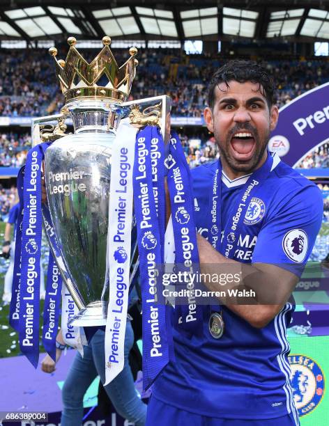 Diego Costa of Chelsea celebrates with the Premier League Trophy after the Premier League match between Chelsea and Sunderland at Stamford Bridge on...