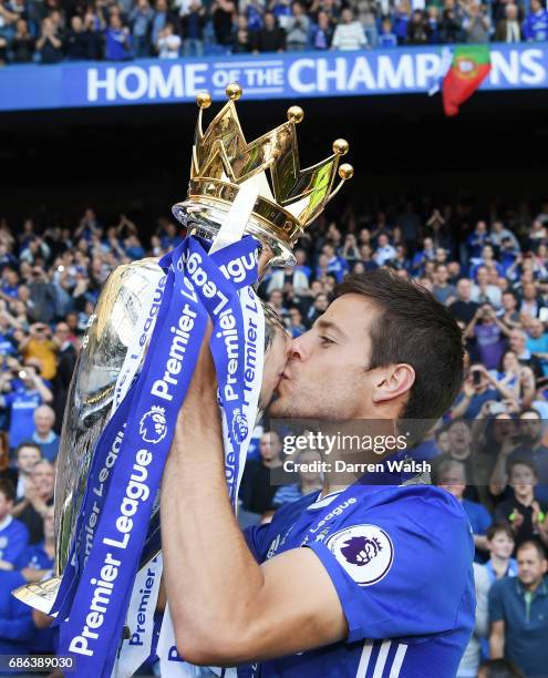 Cesar Azpilicueta of Chelsea kisses the Premier League Trophy after the Premier League match between Chelsea and Sunderland at Stamford Bridge on May...