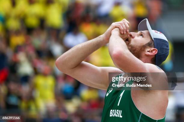 Alison Cerutti of Brazil celebrates the victory after the Men's Finals match against Piotr Kantor and Bartosz Losiak of Poland at Olympic Park during...
