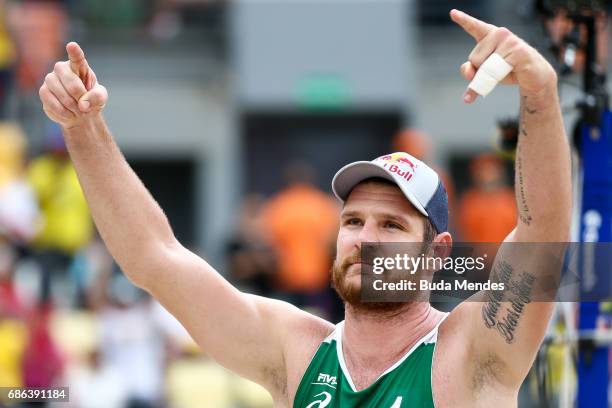 Alison Cerutti of Brazil celebrates the victory after the Men's Finals match against Piotr Kantor and Bartosz Losiak of Poland at Olympic Park during...