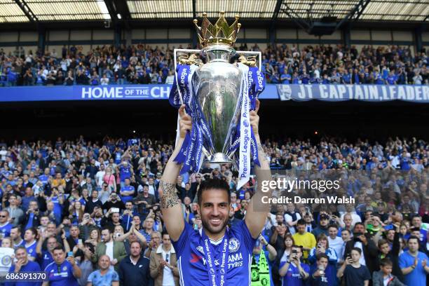 Cesc Fabregas of Chelsea poses with the Premier League Trophy after the Premier League match between Chelsea and Sunderland at Stamford Bridge on May...