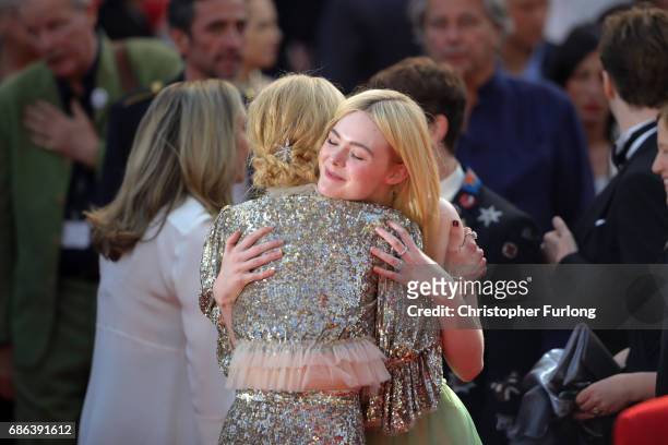 Actresses Elle Fanning and Nicole Kidman embrace after the 'How To Talk To Girls At Parties' screening during the 70th annual Cannes Film Festival at...