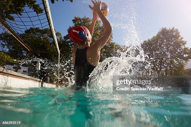 goalie blocking ball in waterpolo - woman goalie stock pictures, royalty-free photos & images